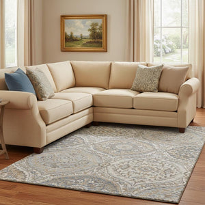 HomeRoots 9' X 12' Washable Floral Area Rug in Beige, Ivory & Blue with UV Protection for High-Traffic Areas 710291