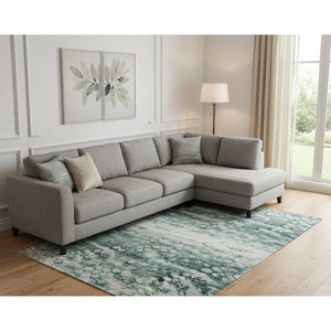 HomeRoots 10' X 14' Teal And Ivory Abstract Area Rug - Washable, UV Protected, Perfect for Homes with Kids & Pets 715393