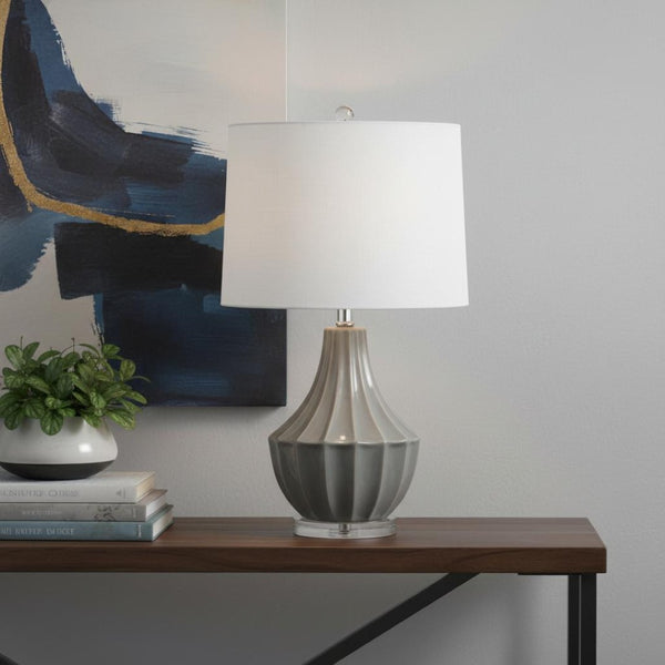 HomeRoots 25" Clear Acrylic Table Lamp with White Drum Shade - Modern Design & Built-in Outlet for Convenience 716171