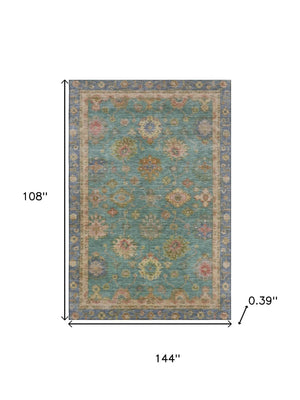 HomeRoots 10' X 14' Teal and Blush Oriental Area Rug – Washable, Stain Resistant, UV Protected for Lasting Beauty 716425