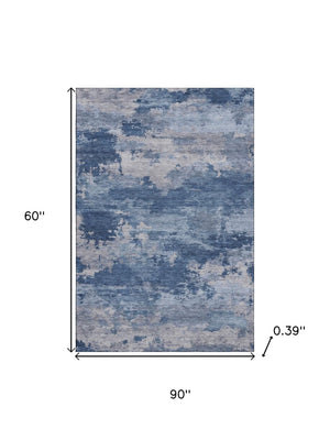 HomeRoots 8' Navy Blue & Denim Abstract Washable Round Rug - Durable, Stain-Resistant with UV Protection 717191