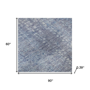 HomeRoots 8' Blue And Ivory Abstract Round Rug - Washable, UV-Protected, Stain-Resistant for Modern Spaces 717323