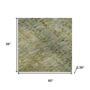 HomeRoots 5' x 8' Green and Gold Abstract Washable Area Rug - Durable, UV-Protected, Machine-Washable Design! 717358