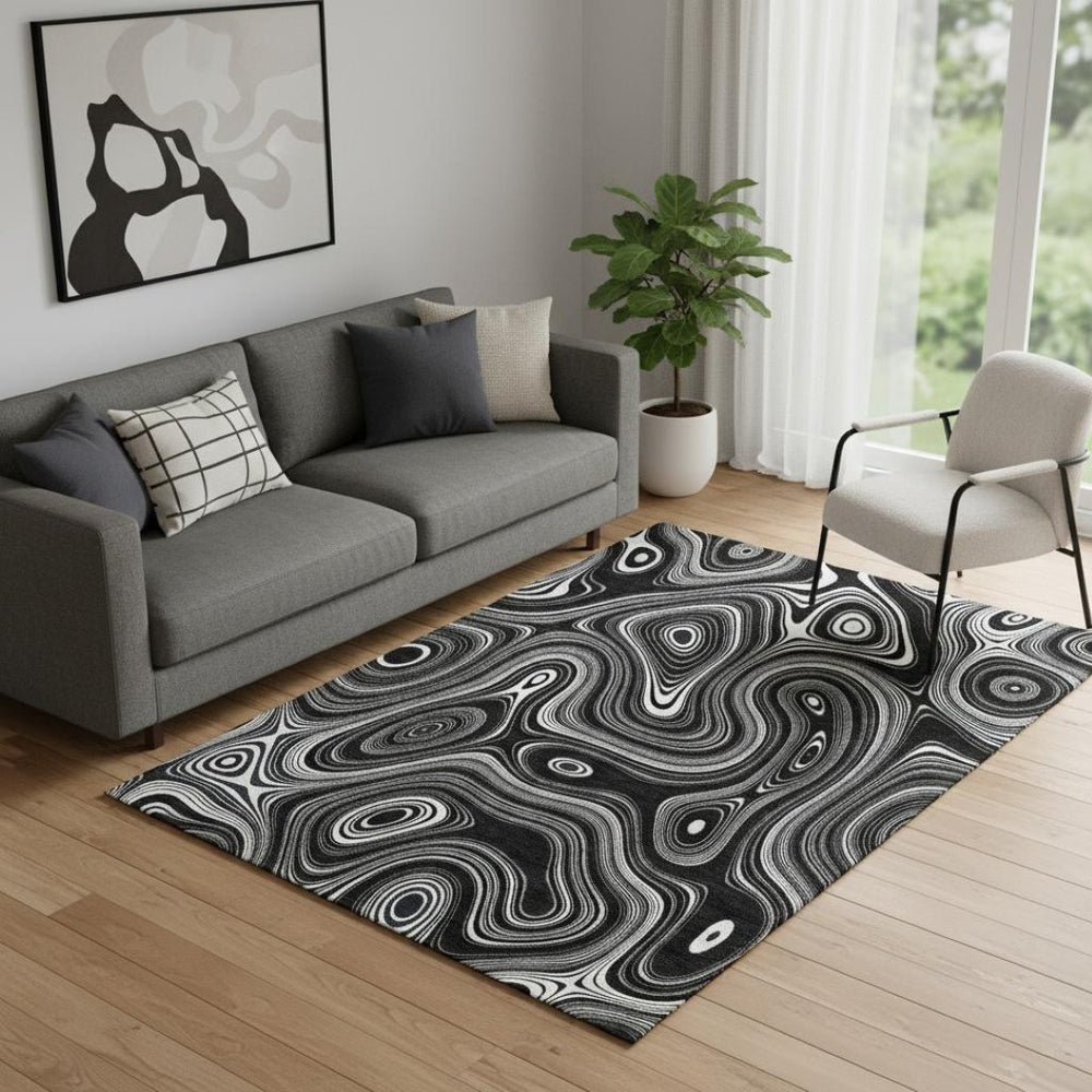 HomeRoots 8' Black and Ivory Geometric Round Rug - Washable, UV Protected, Durable Polyester for Modern Spaces 717708