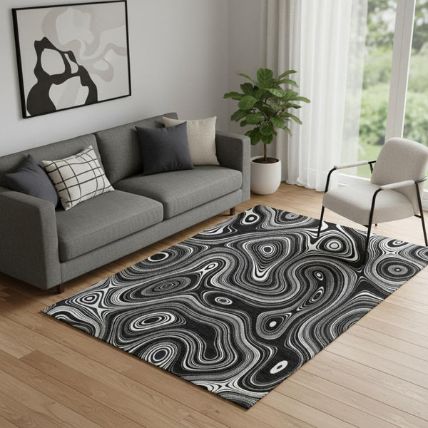 HomeRoots 8' Black and Ivory Geometric Round Rug - Washable, UV Protected, Durable Polyester for Modern Spaces 717708