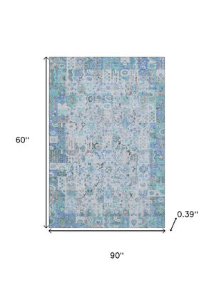 HomeRoots 8' Blue and Ivory Patchwork Washable Round Rug - UV Protected, Stain Resistant, Durable Design for Homes 717758