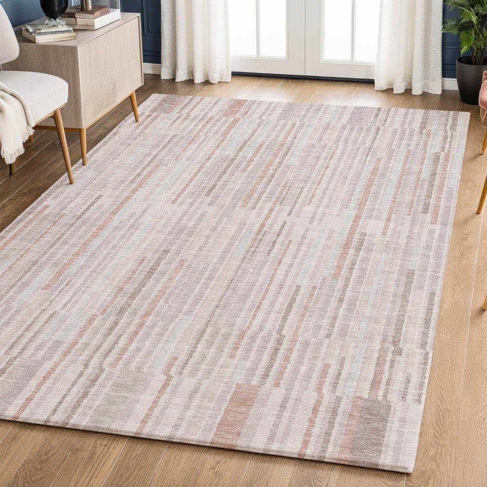 HomeRoots 9' X 12' Coral and Beige Striped Area Rug - Stylish, Washable, UV-Protected for High-Traffic Spaces 717874