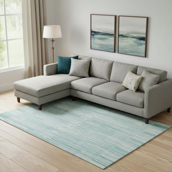 HomeRoots 10' X 14' Striped Turquoise & Sky Blue Washable Area Rug with UV Protection for Easy Care & Style 717911