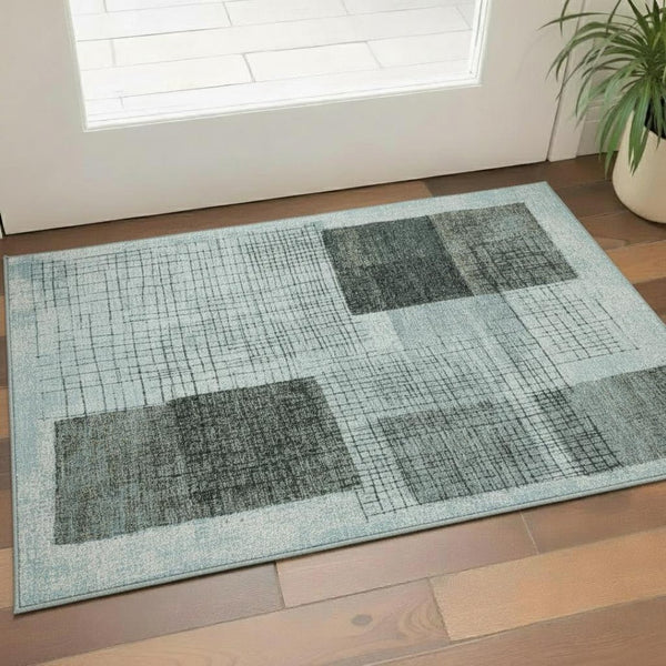 HomeRoots 5' X 8' Teal and Gray Geometric Area Rug – Stylish, Washable & UV-Protected for Kid-Friendly Spaces 718324