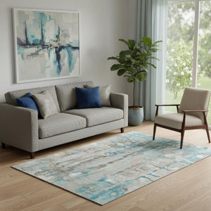 HomeRoots 8' Teal and Ivory Abstract Round Rug - Washable, UV Protected, Durable Design for Busy Homes 718529