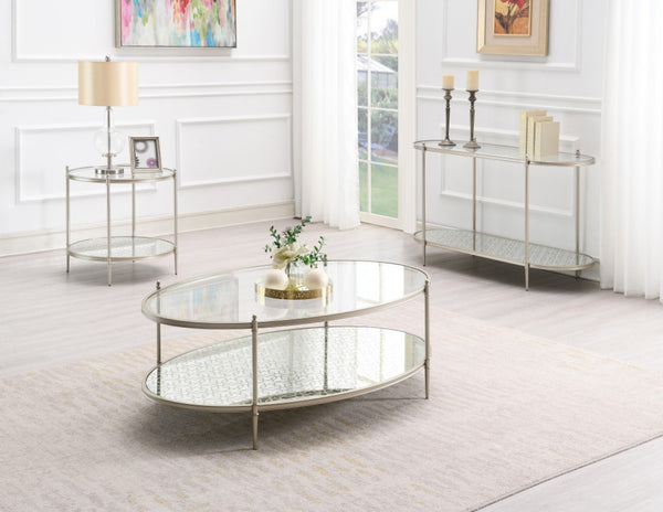 HomeRoots 54" Clear Glass and Champagne Steel Coffee Table with Storage Shelf - Modern Elegance for Any Space 719244