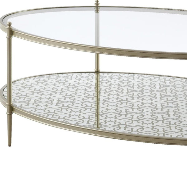 HomeRoots 54" Clear Glass and Champagne Steel Coffee Table with Storage Shelf - Modern Elegance for Any Space 719244