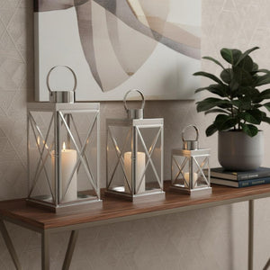 HomeRoots Set of Three Elegant Glass and Gold Stainless Steel Floor Lanterns for Modern Farmhouse Charm 719765