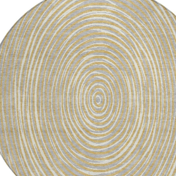 8 Foot Round Geometric Polyester Area Rug in Gold and Ivory for Indoor Outdoor Use