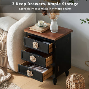 English Elm Vintage Farmhouse End Table with Floral Knobs 3-Drawer Rustic Nightstand Solid Wood Accents Antique Black,Walnut W3306P318870