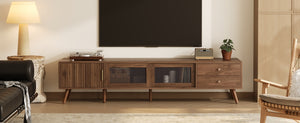 English Elm 76" Modern Minimal TV Stand with Waveform Glass Doors, Soft-Close Drawers, Cable Management, Solid Wood Legs (Fits TVs up to 85") N710P298234P