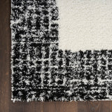 Nourison Pacific Shag PCS02 Machine Made Power-loomed Solid Border Indoor Only Shag Modern Rug Ivory Black, Ivory Black Pile, 100% Polyester 841491148884