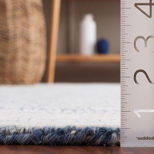 Safavieh Abstract 340 Hand Tufted  Rug Ivory / Navy 5' x 8'