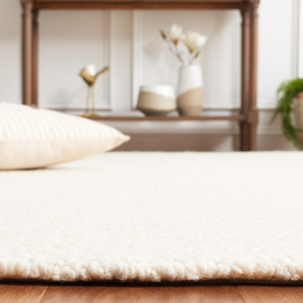 Safavieh Abstract 494 Hand Tufted Abstract Rug Ivory ABT494A-5