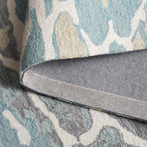 Safavieh Abstract Area Rug - Stunning Hand-tufted Design Enhances Any Space With Ocean-inspired Elegance Blue ,Ivory 80% Wool % 20% Cotton Abt975m-9