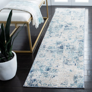 Safavieh Aston Contemporary Area Rug - Luxurious Soft Pile, Power-loomed Elegance For Modern Living Spaces Ivory ,Blue 80% Polypropylene,20% Polyester Asn710m-10