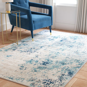 Safavieh Aston Contemporary Area Rug - Luxurious Soft Pile, Power-loomed Elegance For Modern Living Spaces Ivory ,Blue 80% Polypropylene,20% Polyester Asn710m-10