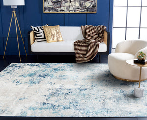 Safavieh Aston Contemporary Area Rug - Luxurious Soft Pile, Power-loomed Elegance For Modern Living Spaces Ivory ,Blue 80% Polypropylene,20% Polyester Asn710m-10