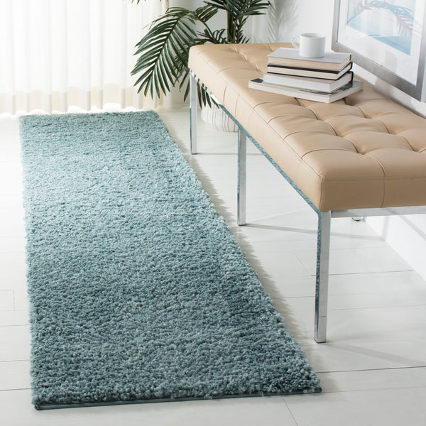 Safavieh August Plush Aqua Shag Rug Round — Flokati Texture, 1 1/8" Pile, Durable Polypropylene-Jute Blend 4'-0" x 4'-0" AUG900J-4R