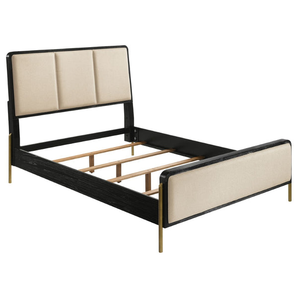 English Elm Benson Eastern King Panel Bed with Cream Upholstery and Aged Brass Leg Accents Black B062S01913