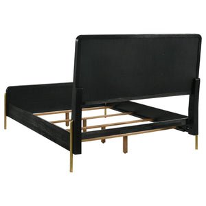 English Elm Benson Eastern King Panel Bed with Cream Upholstery and Aged Brass Leg Accents Black B062S01913