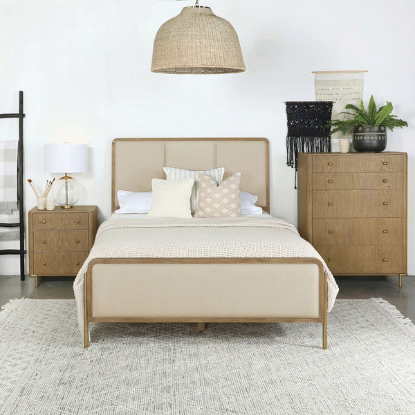 English Elm Benson Eastern King Panel Bed with Cream Upholstery and Aged Brass Leg Accents Sand B062S01914
