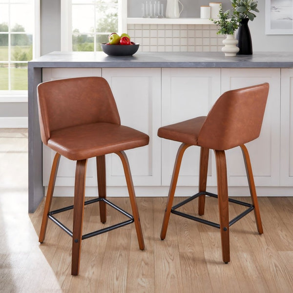 English Elm 24 Inch Mid-Century Swivel Counterstools with Walnut Legs and Camel Faux Leather Set of 2 Black B202P291054