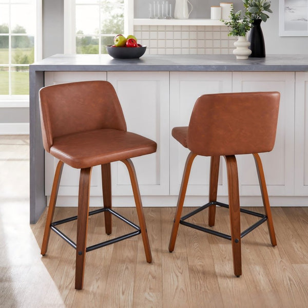 English Elm 24 Inch Mid-Century Swivel Counterstools with Walnut Legs and Camel Faux Leather Set of 2 Black B202P291054