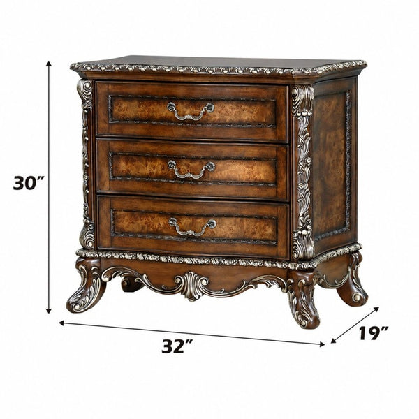 English Elm Devany 3-drawer Antique Oak Bedside Chest with Carved Scrollwork and Champagne Accents B2770P520678