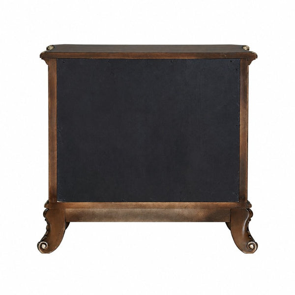 English Elm Devany 3-drawer Antique Oak Bedside Chest with Carved Scrollwork and Champagne Accents B2770P520678
