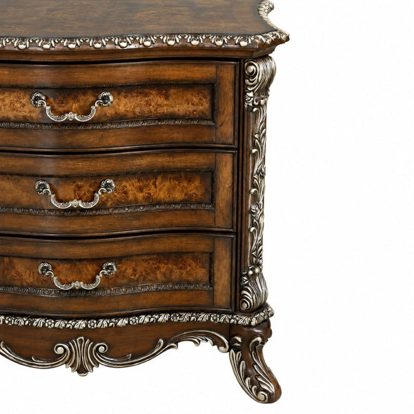 English Elm Devany 3-drawer Antique Oak Bedside Chest with Carved Scrollwork and Champagne Accents B2770P520678