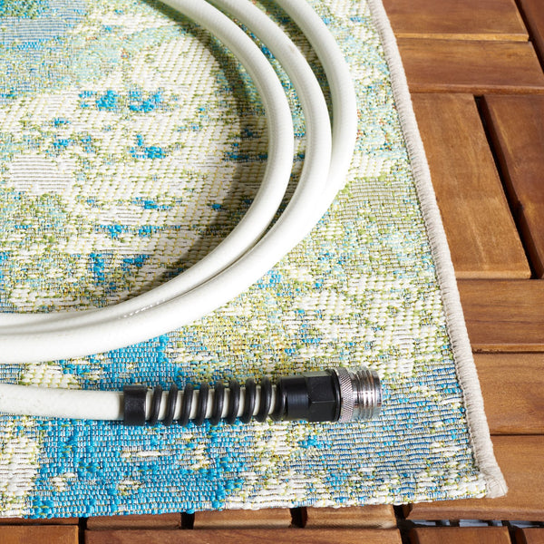 Safavieh Barbados Area Rug - Elegant Botanical Design In Blue And Ivory For Indoor & Outdoor Spaces Blue ,Ivory 76% Polypropylene,23% Polyester,1% Backing Material Bar594m-9