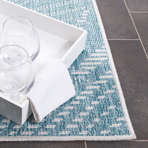 Safavieh Beach House Elegant Indoor/Outdoor Area Rug - Stylish, Durable, And Perfect For Coastal Living Spaces Aqua ,Ivory 85% Polypropylene,15% Polyester Bhs264j-7r