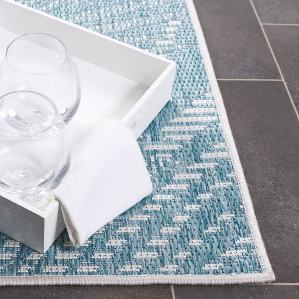 Safavieh Beach House Elegant Indoor/Outdoor Area Rug - Stylish, Durable, And Perfect For Coastal Living Spaces Aqua ,Ivory 85% Polypropylene,15% Polyester Bhs264j-7r