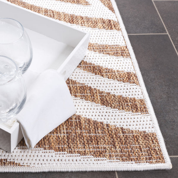 Safavieh Beach Modern Elegance Area Rug – Stylish Charcoal & Ivory Design For Indoor/Outdoor Spaces Brown ,Ivory 85% Polypropylene,15% Polyester Bhs294t-28