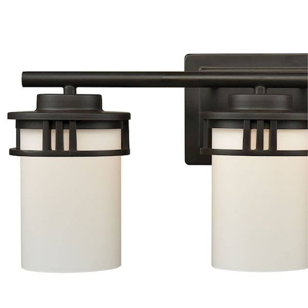 Thomas Lighting Ravendale Two Light Vanity Fixture with Cylindrical Glass Shades for Modern Bathrooms Bronze 20'' Wide 3-Light Vanity Light CN578311