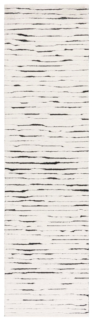Safavieh Casablanca Hand-tufted Wool Area Rug - Elegant Ivory And Black Design For Timeless Home Decor Ivory ,Black Wool Pile Csb227a-5