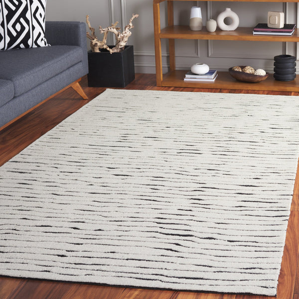 Safavieh Casablanca Hand-tufted Wool Area Rug - Elegant Ivory And Black Design For Timeless Home Decor Ivory ,Black Wool Pile Csb227a-5