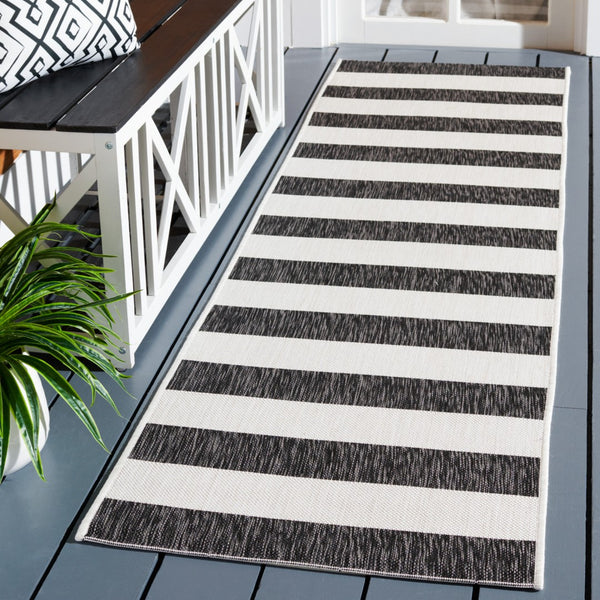 Safavieh Courtyard Modern Striped Area Rug - Elegant Turkish Design For Chic Home Decor & Comfort Upgrade Ivory ,Black 88% Polypropylene,12% Polyester Cy8812-53712-5r