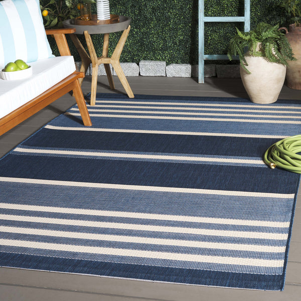 Safavieh Resort Power-loomed Area Rug With Timeless Flora Motifs For Luxurious Living Spaces And Style Navy Blue ,Beige 85.4% Polypropylene,10.4% Polyester,4.2% Latex Cys3356-25821-5