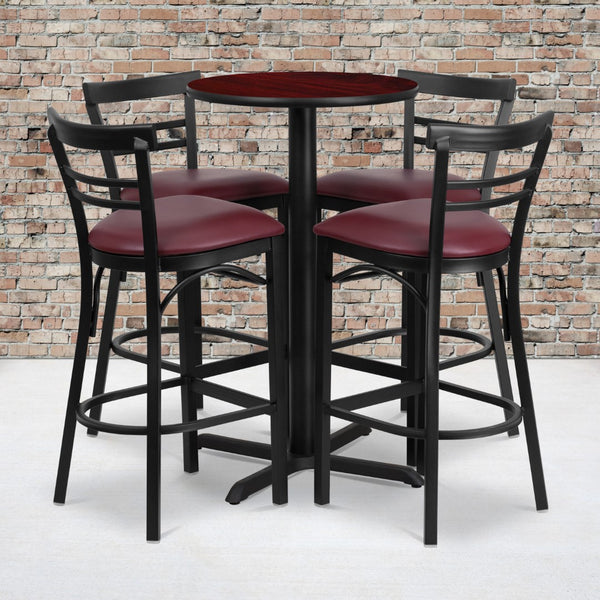 English Elm Commercial Grade 24'' Round Mahogany Laminate Table Set with X-Base and 4 Two-Slat Ladder Back Metal Barstools - Vinyl Seat