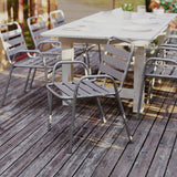 English Elm Commercial Grade Commercial Metal Indoor-Outdoor Restaurant Stack Chair with Metal Triple Slat Back and Arms