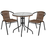 English Elm Commercial Grade 28'' Round Glass Metal Table with Rattan Edging and 2 Rattan Stack Chairs