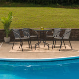 English Elm Commercial Grade 28'' Round Glass Metal Table with Rattan Edging and 4 Rattan Stack Chairs