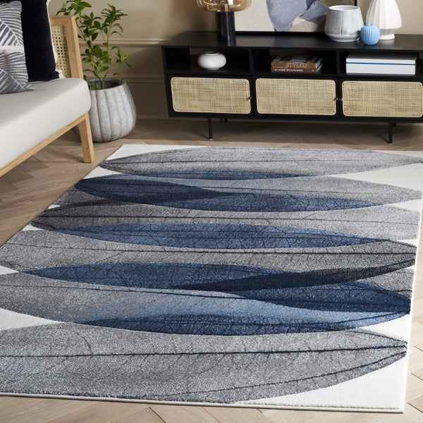 Safavieh Hollywood Abstract Ivory Blue Polypropylene Area Rug Power Loomed for Living Rooms HLW703B-6